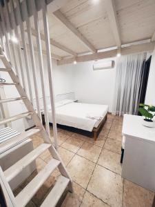 Postel nebo postele na pokoji v ubytování Agriturismo La Rustica