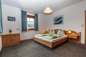 A bed or beds in a room at Seeappartements Bacher