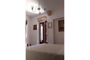 A bed or beds in a room at B&B DIMORA PALMIERI