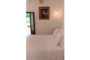 A bed or beds in a room at B&B DIMORA PALMIERI