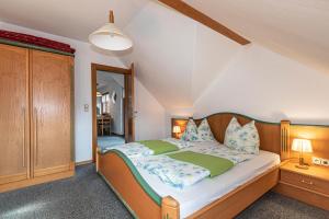 A bed or beds in a room at Seeappartements Bacher