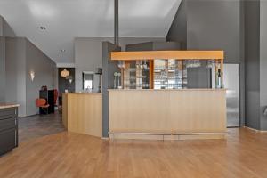 a lobby with a counter and a bar at Hotel Kvika in Ölfus +58 photos