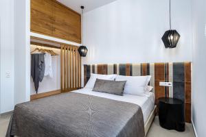 Postel nebo postele na pokoji v ubytování Remezzo Bayfront Suites
