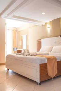 Кровать или кровати в номере Montana Guest Resort Naivasha