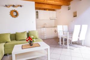 a living room with a couch and a table at Oleander in Portorož