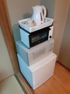Příslušenství pro přípravu čaje a kávy v ubytování OHTO Ryokan