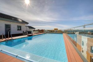 a large swimming pool on top of a building at Ventum Suite in Tarifa