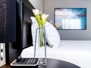 Postel nebo postele na pokoji v ubytování Grand Mercure Sao Paulo Vila Olimpia