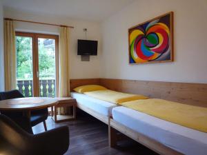 Cama o camas de una habitación en Ferienwohnungen Braiter