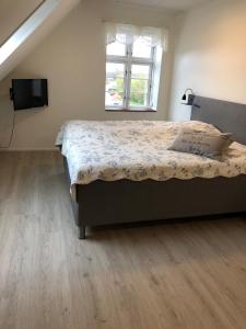Krevet ili kreveti u jedinici u okviru objekta Hotel Højslev Kro