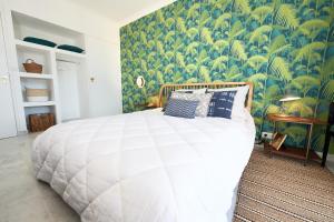 Ein Bett oder Betten in einem Zimmer der Unterkunft Palm Beach Amazing view