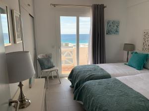 Postel nebo postele na pokoji v ubytování Apartamento en Playa Santo Tomas