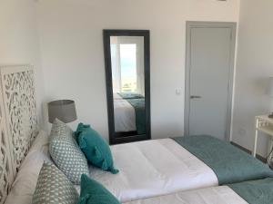 Postel nebo postele na pokoji v ubytování Apartamento en Playa Santo Tomas