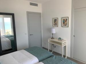 Postel nebo postele na pokoji v ubytování Apartamento en Playa Santo Tomas
