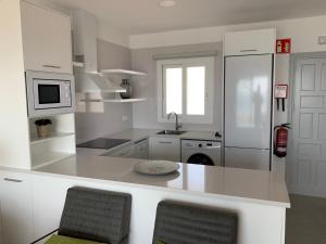 Kuchyň nebo kuchyňský kout v ubytování Apartamento en Playa Santo Tomas