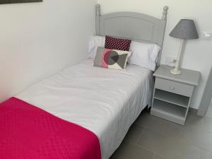 Postel nebo postele na pokoji v ubytování Apartamento en Playa Santo Tomas