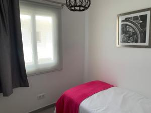 Postel nebo postele na pokoji v ubytování Apartamento en Playa Santo Tomas