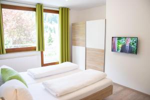 Postel nebo postele na pokoji v ubytování Klamberghof Burgstaller
