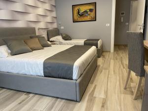 Postel nebo postele na pokoji v ubytování Martini Suite