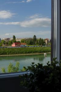 a view of a river from a window at Cozy river view apartment in Karlovac
