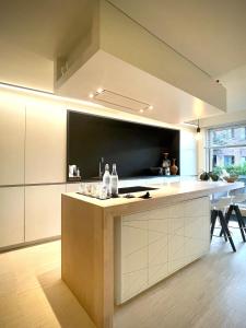 a kitchen with a large island in the middle at Desk Till Dawn in Ghent