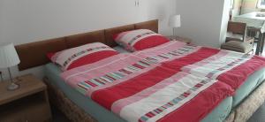 
Łóżko lub łóżka w pokoju w obiekcie Pokoje Herta - agroturystyka
