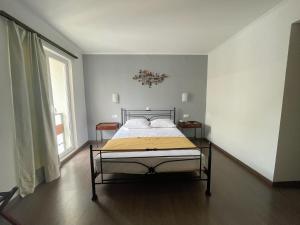 Postel nebo postele na pokoji v ubytování Nafplia Hotel