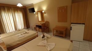A bed or beds in a room at THEMIS BEACH