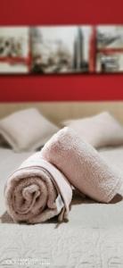 a towel sitting on top of a bed at Cosy Well Located Apartment Tenerife Sur Golf in San Miguel de Abona