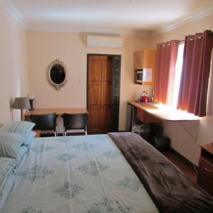 Ένα ή περισσότερα κρεβάτια σε δωμάτιο στο Accommodation@Bourne