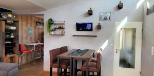 a dining room with a table and some chairs at Friesenkate Bensersiel in Esens