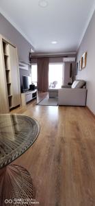 a large living room with a bed and a couch at Cosy Well Located Apartment Tenerife Sur Golf in San Miguel de Abona
