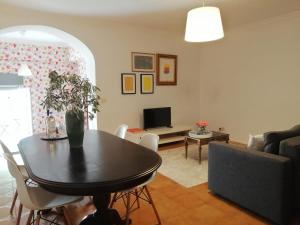 a living room with a table and a couch at House in the Town Centre in Caminha