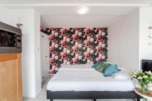 Een bed of bedden in een kamer bij Appartement en Studio Papillon