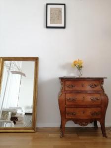 a dresser and a mirror next to a dresser at House in the Town Centre in Caminha