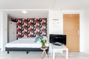 Postel nebo postele na pokoji v ubytování Appartement en Studio Papillon