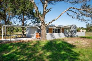 a house with a tree in the yard at Rubiaceae in Lorraine