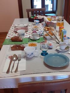 a table with food and utensils on it at B&B Borgo Revelia in Rivello