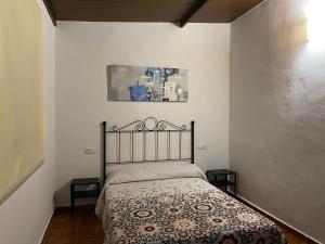 Postel nebo postele na pokoji v ubytování Alojamiento Rural Setenil