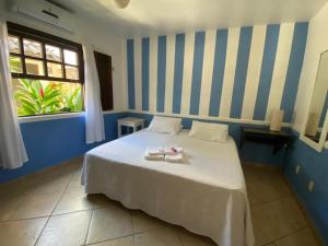 Katil atau katil-katil dalam bilik di Pousada dos Contos