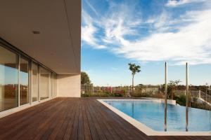 a view from the deck of a house with a swimming pool at Spacious sunset Villa with breathtaking view in Portimão