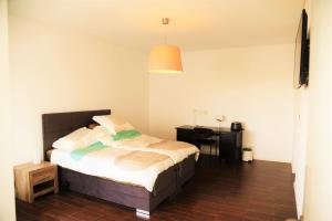 a bedroom with a bed and a desk in it at Spacious sunset Villa with breathtaking view in Portimão +13 photos