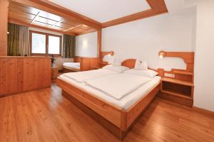 Postel nebo postele na pokoji v ubytování Apart Alpenpension Maderer + 37 fotografií