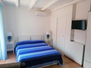 A bed or beds in a room at MOLO 78 Case Vacanze