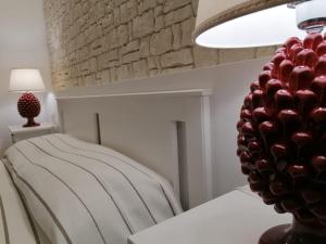 A bed or beds in a room at MOLO 78 Case Vacanze