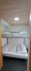 a room with two bunk beds in a building at SUN and FUN in Blankenberge