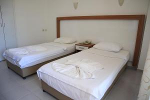Ένα ή περισσότερα κρεβάτια σε δωμάτιο στο Kleopatra smile hotel