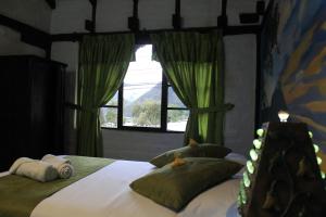Letto o letti in una camera di Hostal Inti Luna