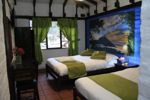 Postel nebo postele na pokoji v ubytování Hostal Inti Luna + 37 fotografií