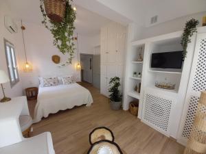 a dog laying on the floor in a room at Patmos Little Suites in Skala